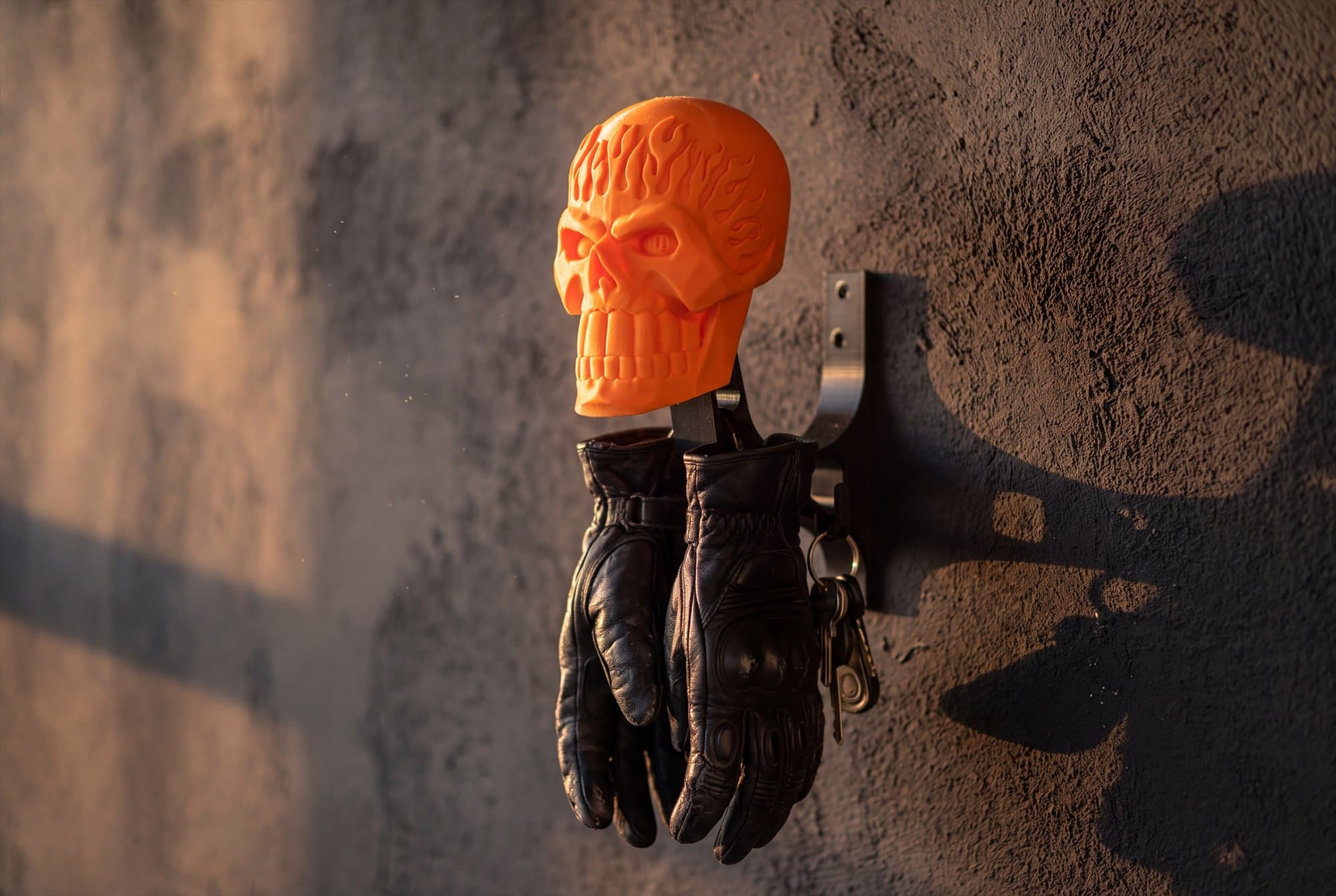 Riding gloves hanging from the hooks on the mount